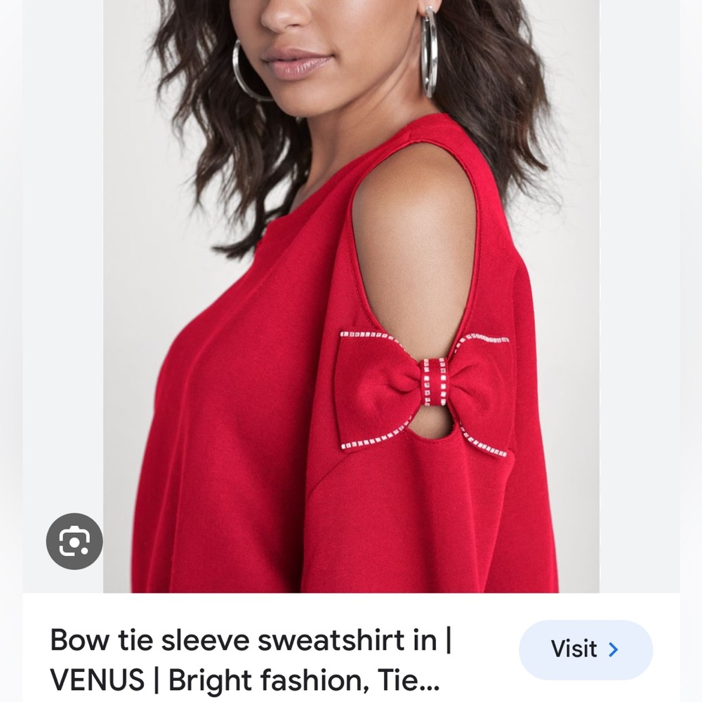 Cold shoulder bow sweater